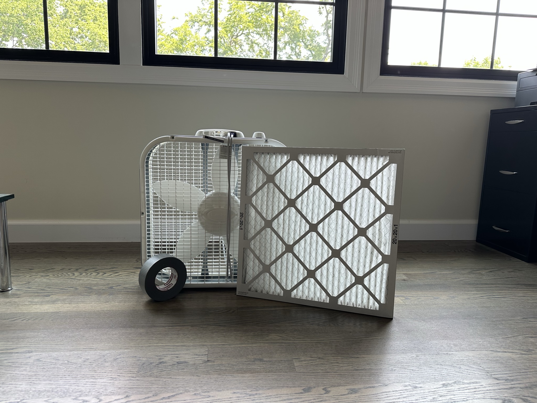 Box fan, duct tape and an air filter used to make a DIY air cleaner