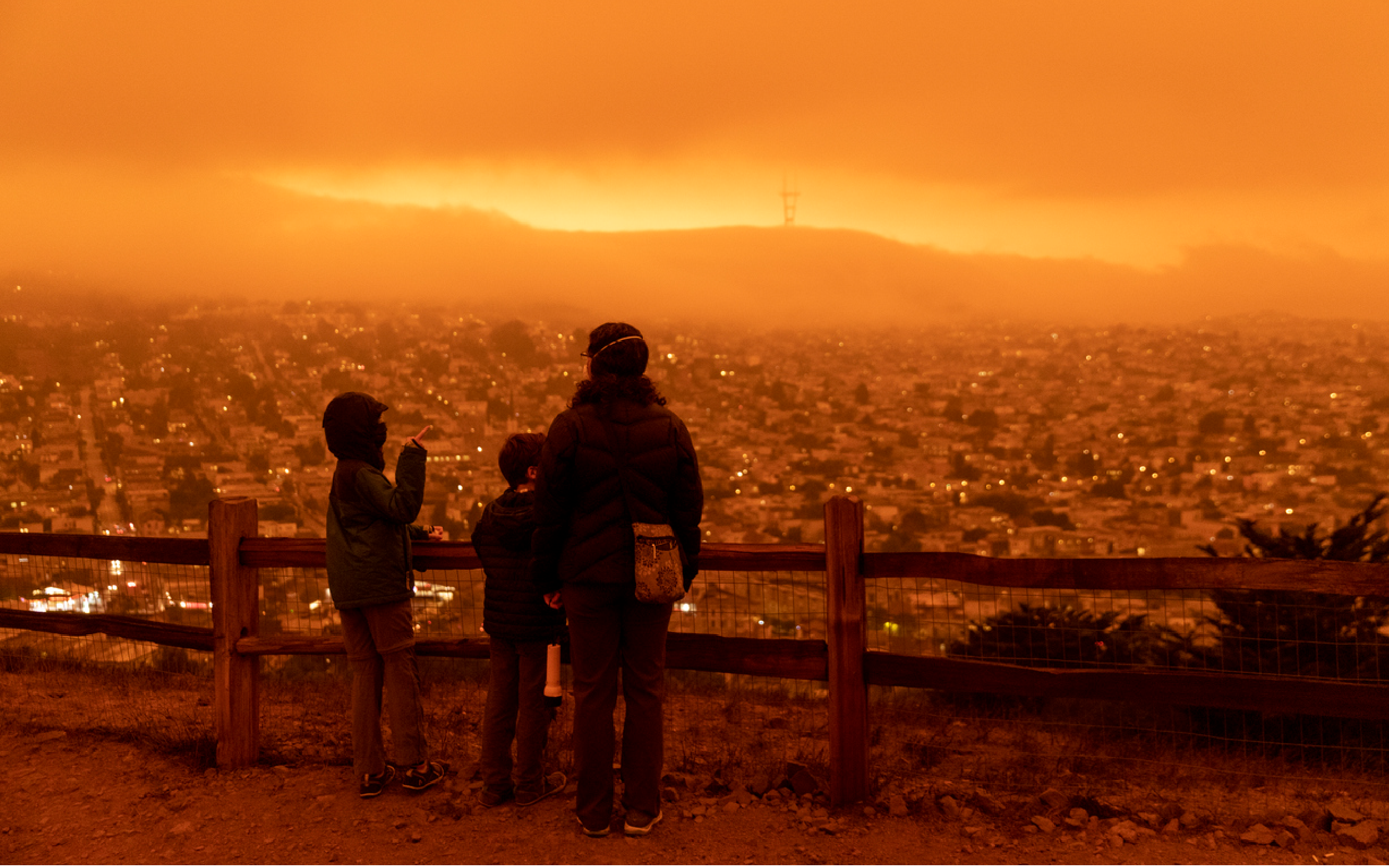 People viewing a wildfire in the distance.