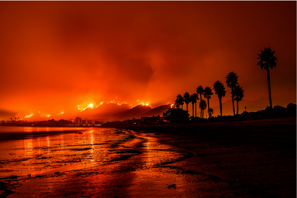 Smoke-filled sky over a beach